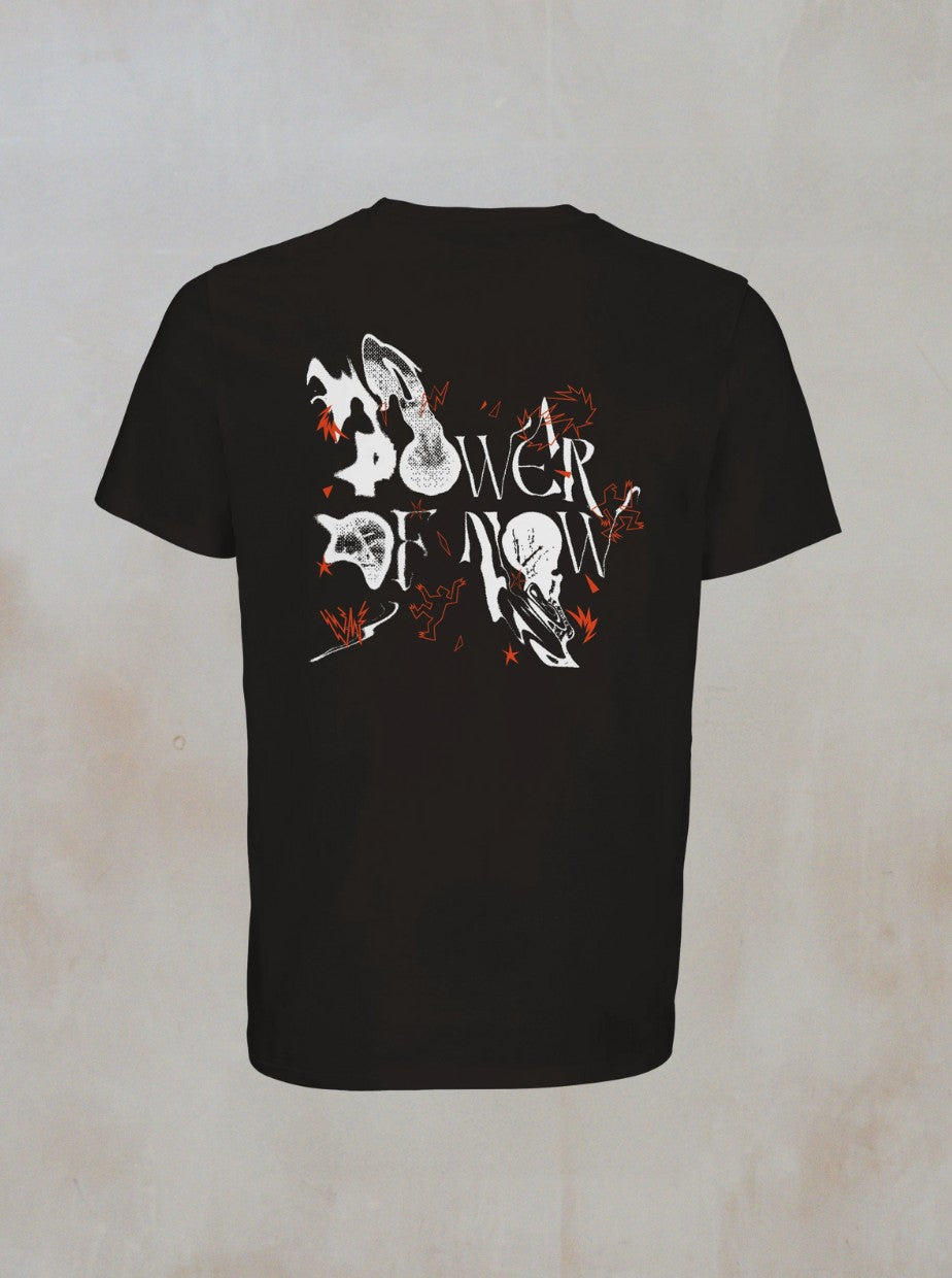The Mono T-Shirt by Boomtown Fair Shop features a Halloween-inspired back graphic with white ghosts, bats, upside-down shoes, orange accents, and Lower Down text. Made from organic cotton, it offers a stylish minimalist design.