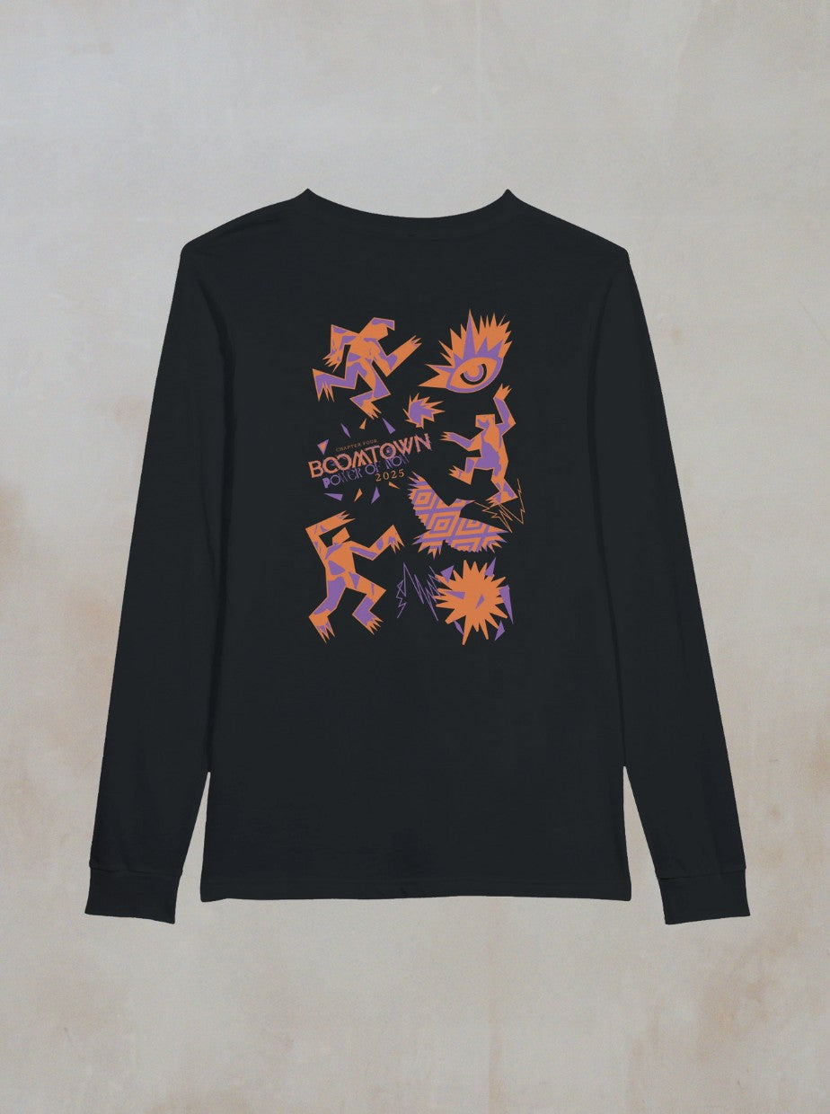 The Zephyr Long Sleeve by Boomtown Fair Shop is a black top with a vibrant back graphic of abstract figures, fire bursts, and bold Boomtown text in orange, purple, and pink—perfect for festivals.