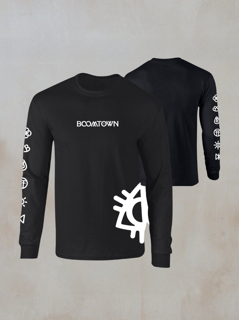 The Boomtown Fair Shop’s Boomtown Black Long Sleeve T-Shirt is made from organic cotton, featuring white BOOMTOWN text on the chest, geometric sleeve symbols, a large eye graphic on the front, and a plain black back.
