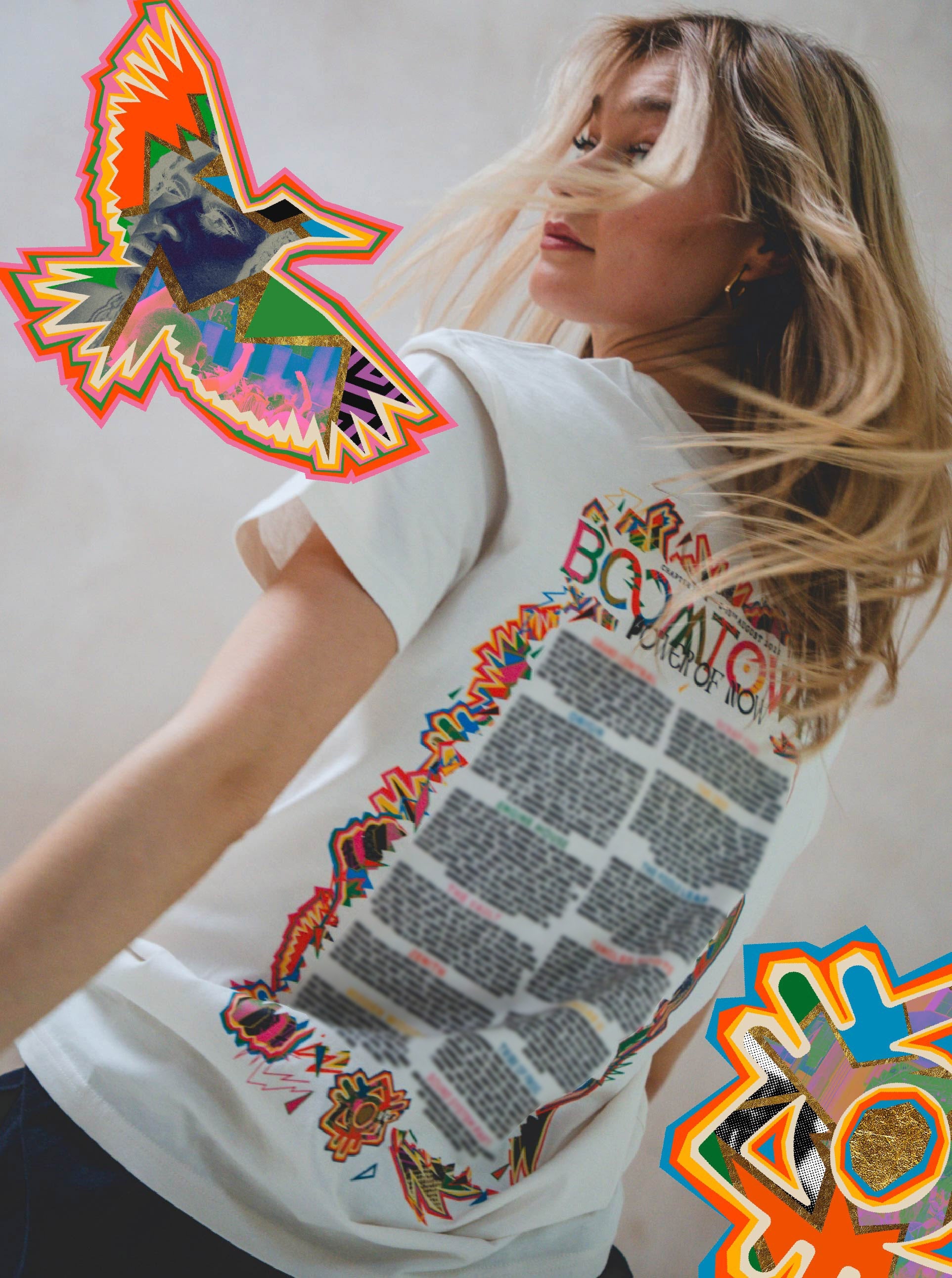 A woman with blonde hair looks over her shoulder, wearing the white Power of Now: Line Up T-Shirt by Boomtown Fair Shop, featuring colorful graphics and stickers of a bird and abstract shapes inspired by the festival’s line-up.
