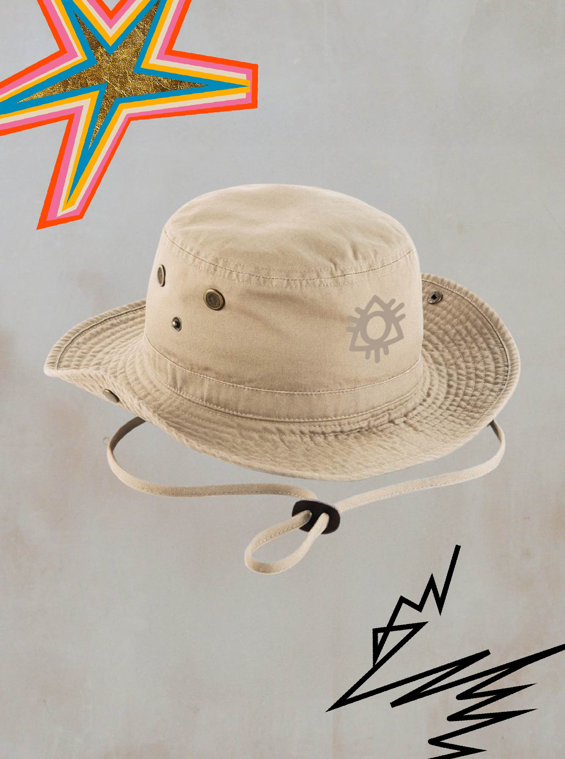 The Safari Hat Tan by 2025 sits centered on a light gray background with playful star and zigzag doodles, featuring an adjustable strap and logo—an ideal festival accessory.