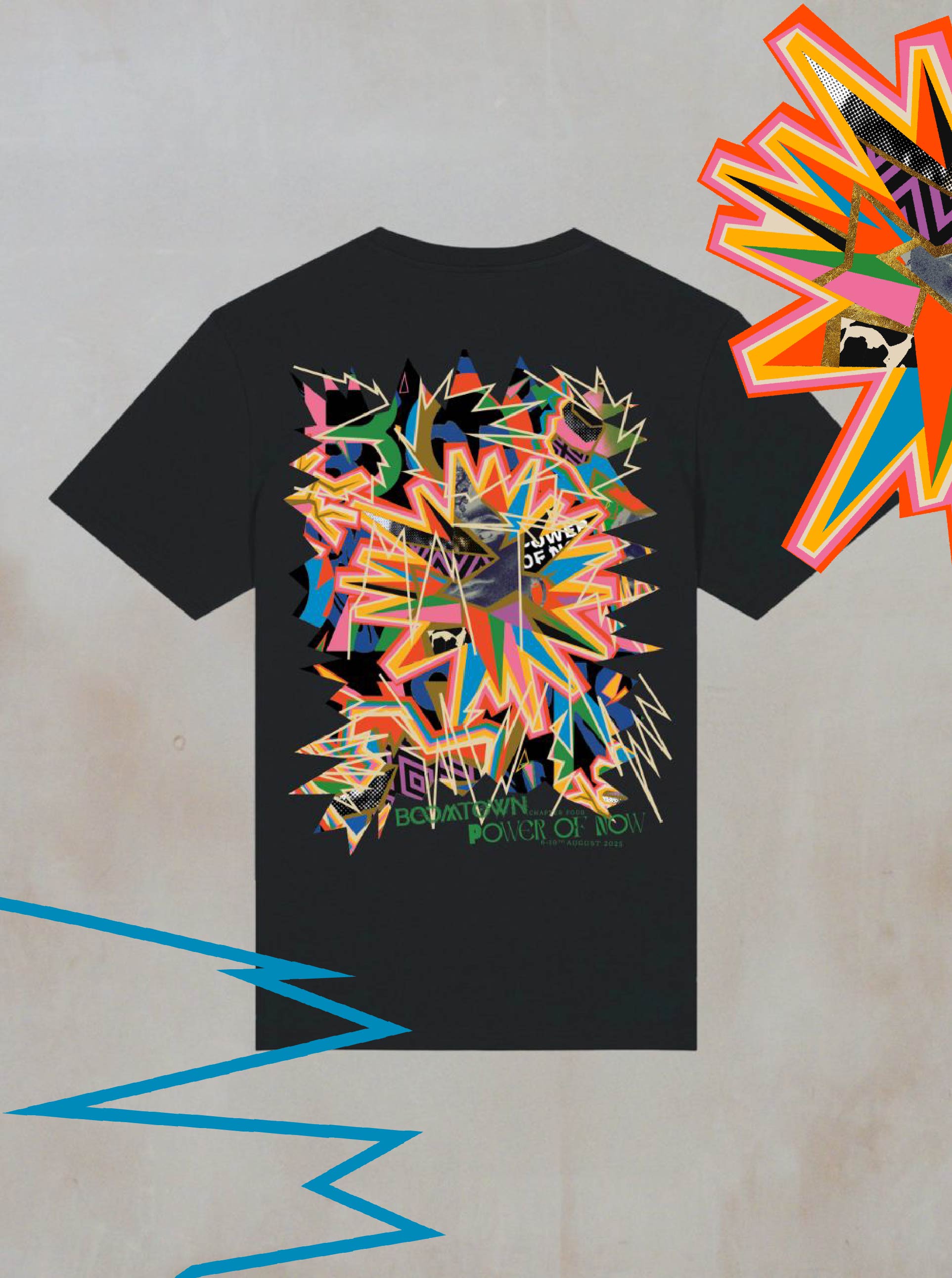 The Power of Now Graphic T-Shirt by Boomtown Fair Shop is a black, organic cotton tee with a vibrant multicolored geometric and jagged abstract design on the back, shown flat against a neutral backdrop with bold patterns around it.
